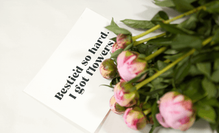 Peony bouquet with a card saying 'Bestied so hard! I got flowers!' for best friends gift.